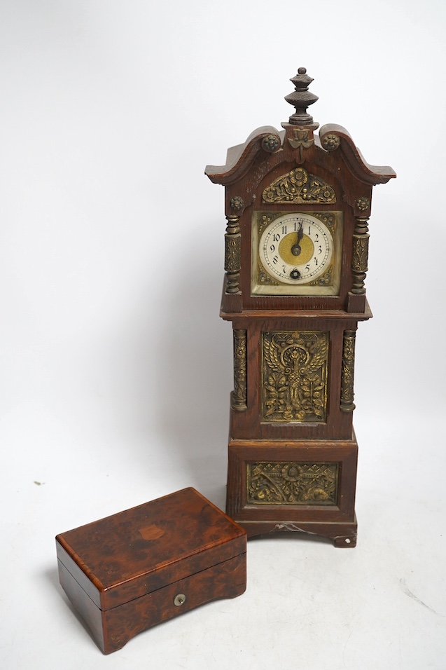 A miniature longcase clock and a miniature yew cylinder musical box, largest 42cm high. Condition - box poor, clock good